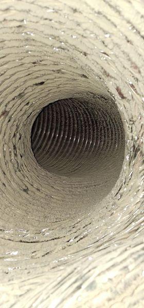 Severely dirty duct before cleaning